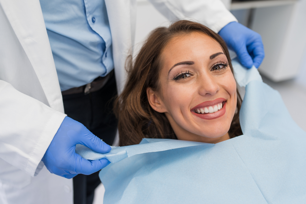 patient in dental chair with beautiful smile